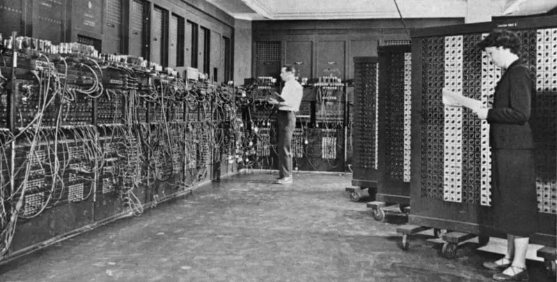 Two people working with the ENIAC computer. 